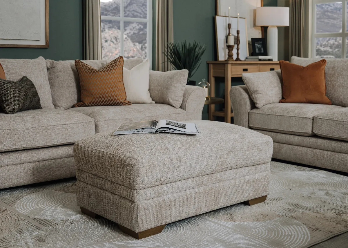 A lifestyle image of the Skyline footstool with skyline corner sofa.