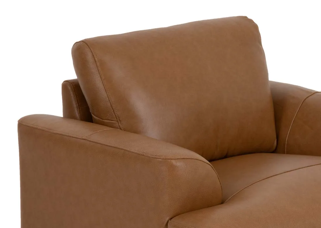 A tan brown leather armchair from EZ Livings Legend range. Closeup of leather finish.
