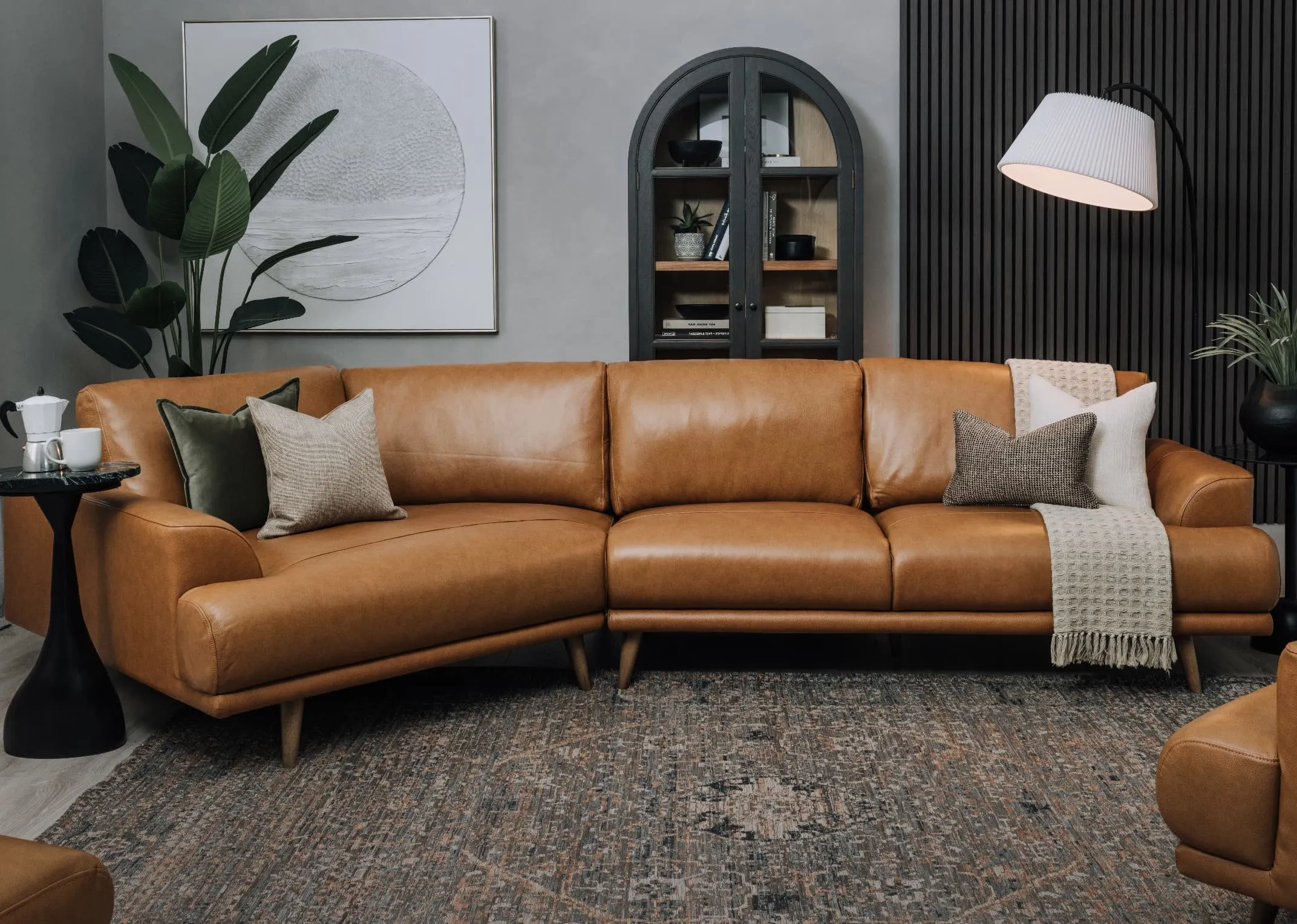A lifestyle image of the Legend brown leather sofa with Maxima rug