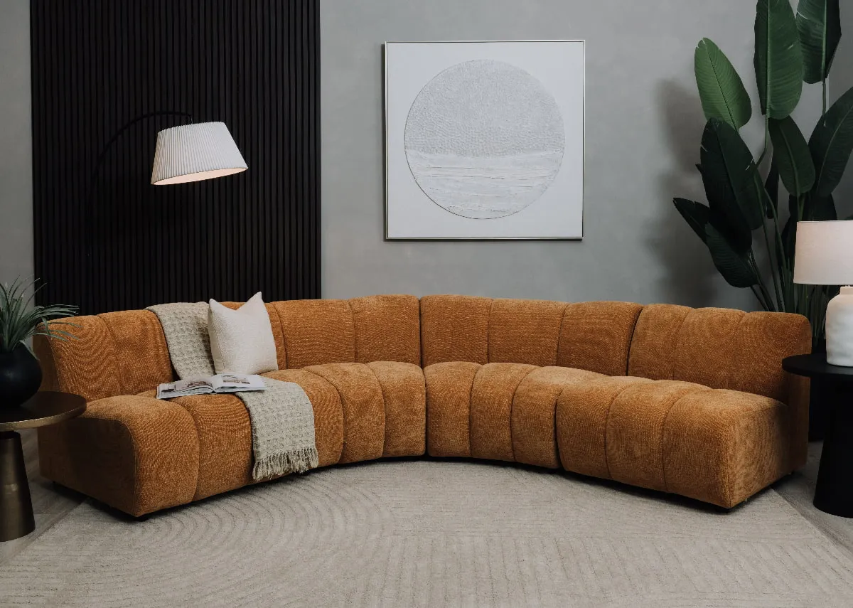 A lifestyle image of the Tokyo corner sofa with Pathways canvas and Arc floor lamp.