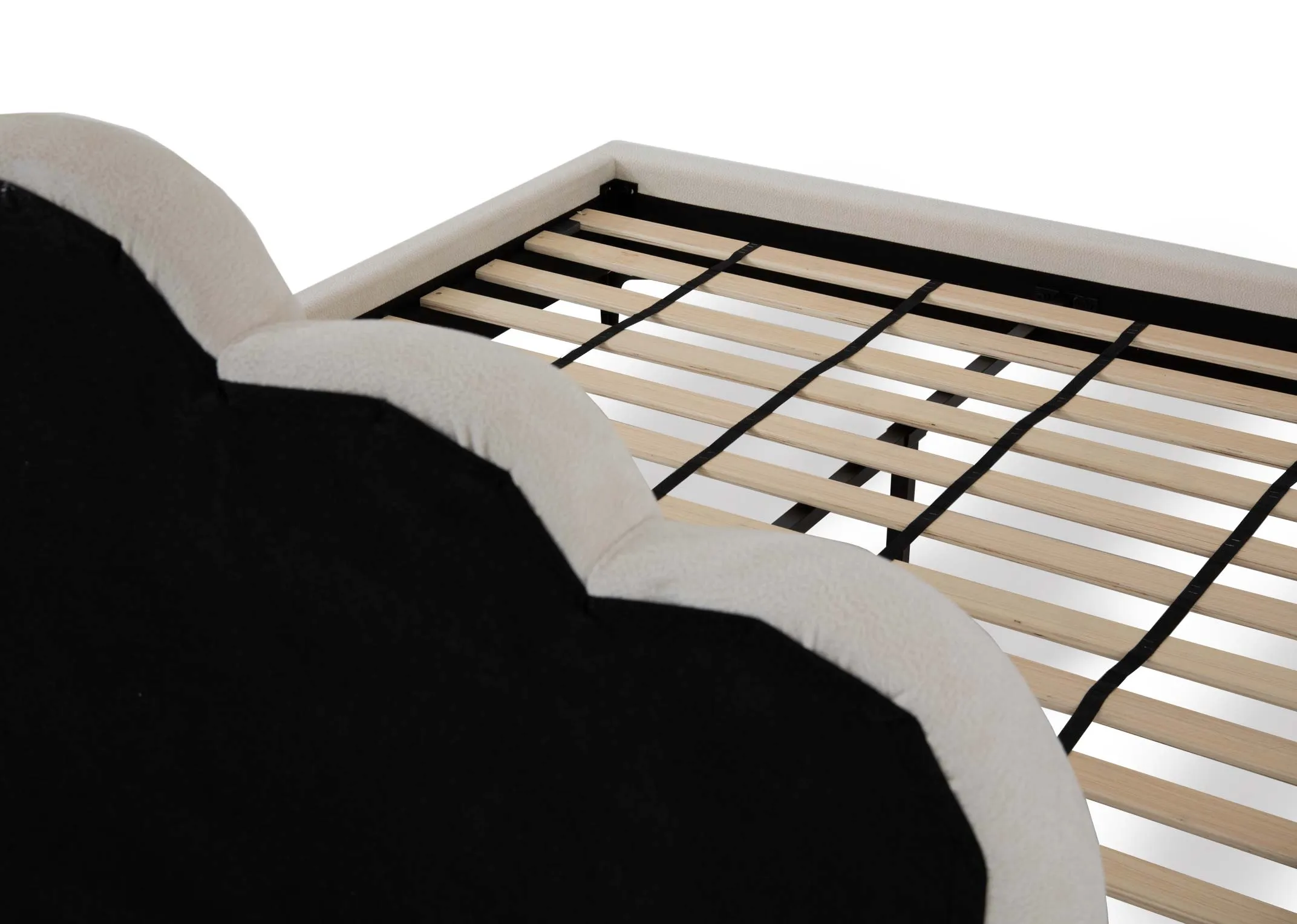 A cream velvet bedframe with scallop headboard from EZ Living Furnitures Faye range.Side view of metal feet.