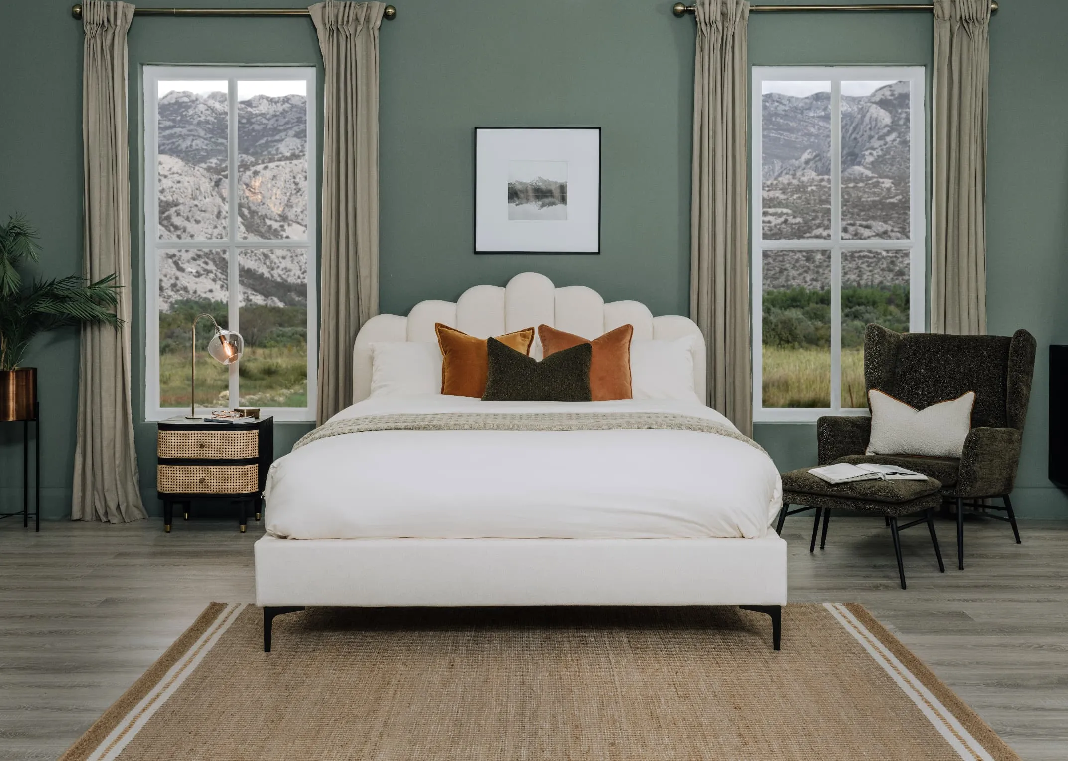 A lifestyle image of the Faye cream velvet bedframe with Lenny locker and Boston green chair and footstool.