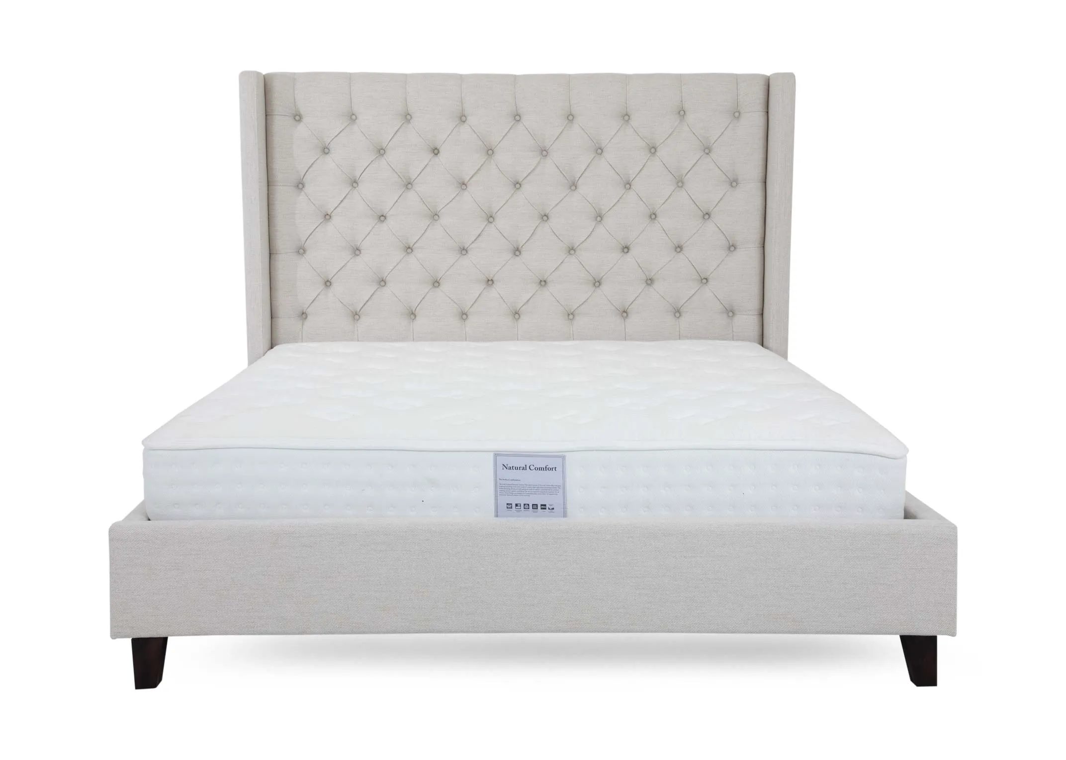 A cream fabric bedframe with high tufted headboard from EZ Livings Enhance range. A front view of tufted high head and low footboard