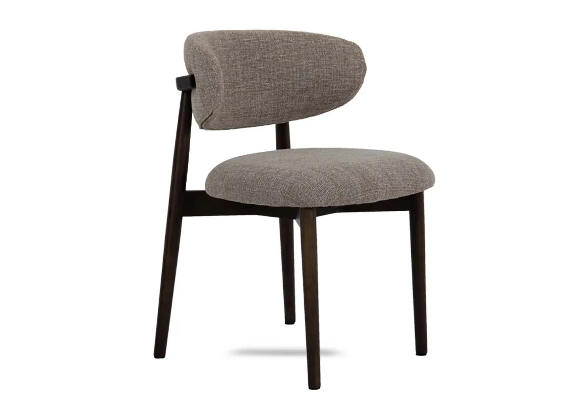 A beige dining chair with fabric seat and back with wood frame from EZ Livings Hazel range. Angled view.