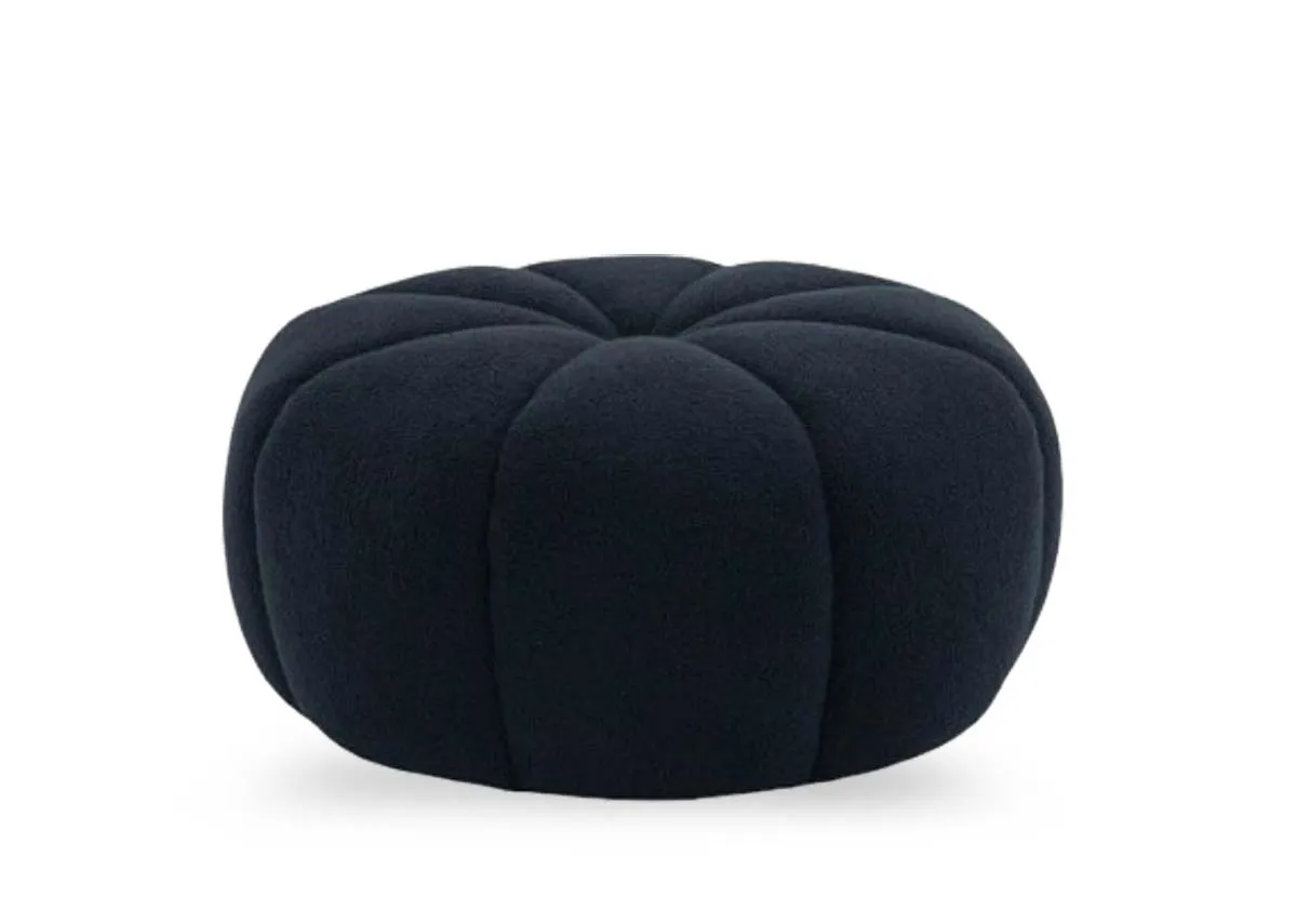 A blue fabric round footstool from EZ Livings Cloudy Range. Front view