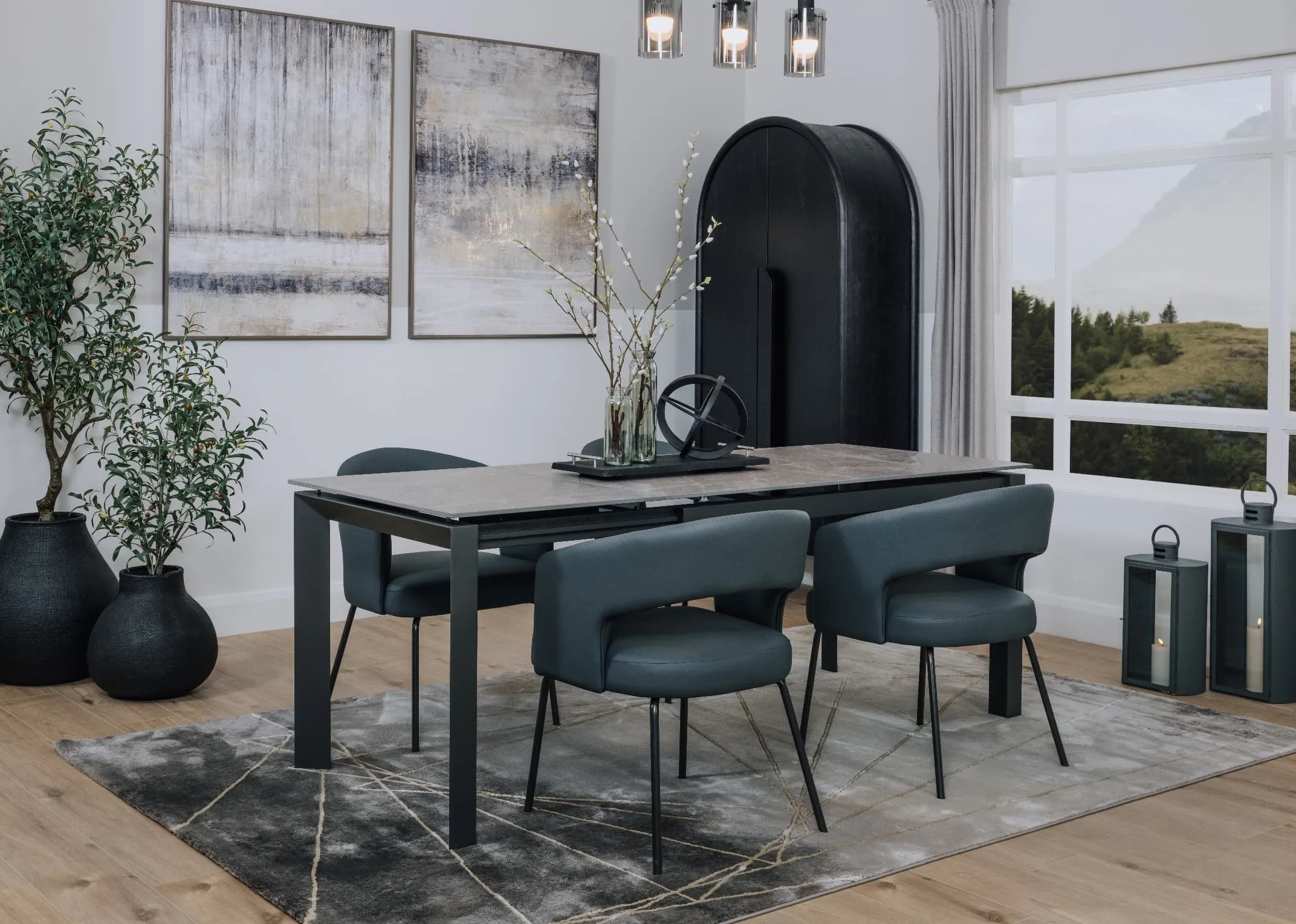 A lifestyle image of the Torrent Canvas I & II with avery rug and Matteo dining chairs.
