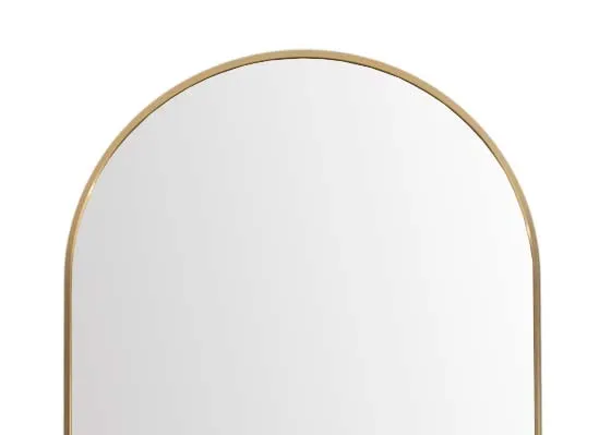 A large free standing mirror with arched top from EZ Livings Vance range. Closeup of gold trim