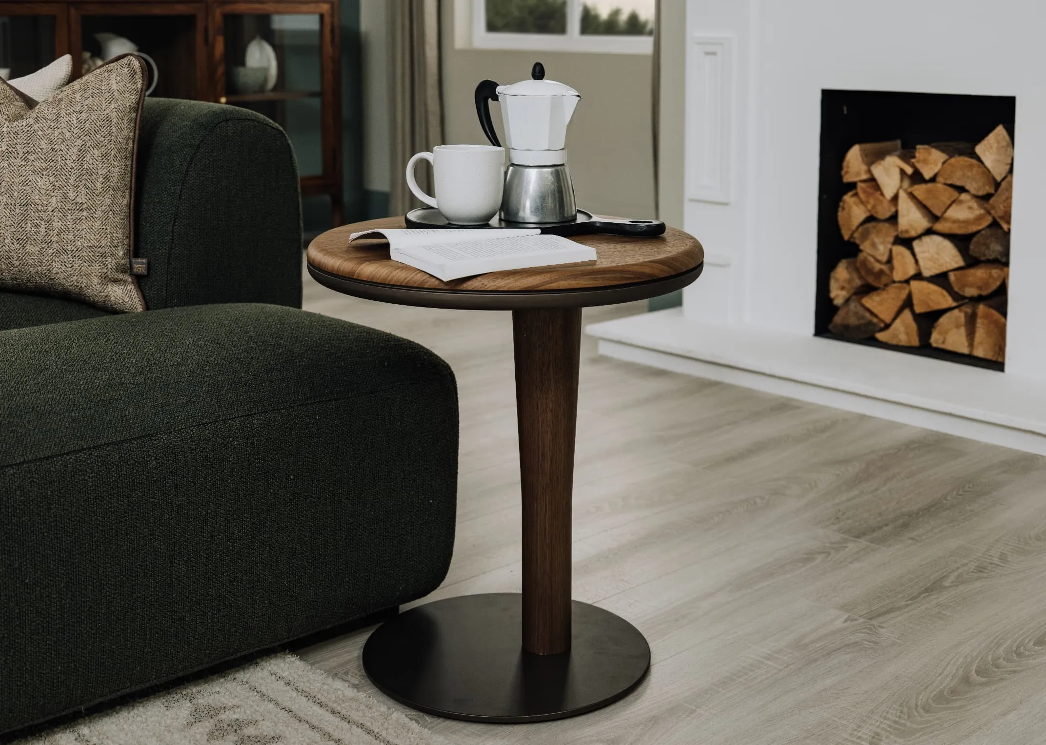 A lifestyle image of the Breeze sofa table next to the Mia chaise end with teapot