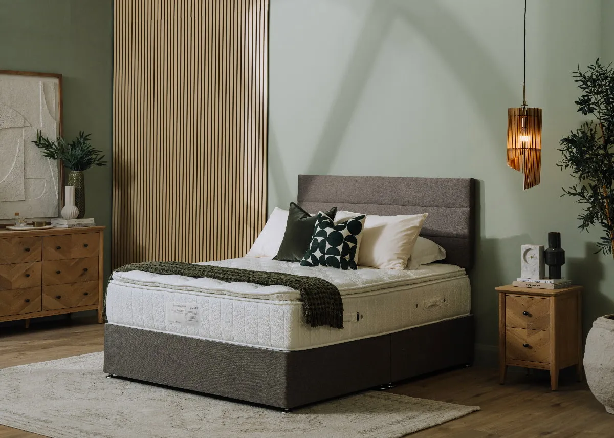 A lifetsyle image of the Latex Elite mattress on a divan bed with chevron locker and chest