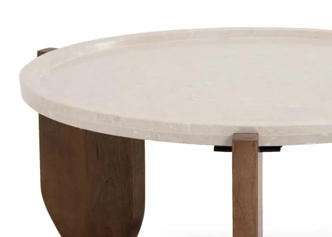 A round marble top coffee table with three mango wood feet from EZ Livings Carmen range. Closeup of round lipped tabletop.