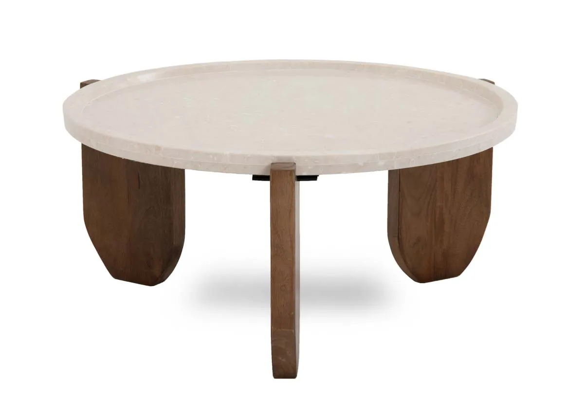 A round marble top coffee table with three mango wood feet from EZ Livings Carmen range. Angled view