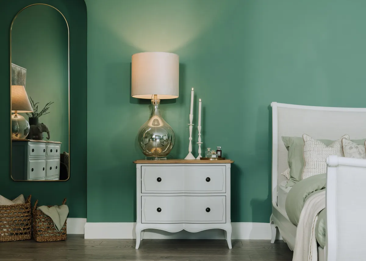 A lifestyle iamge of the Agusta lamp with Amelie locker with bedframe.