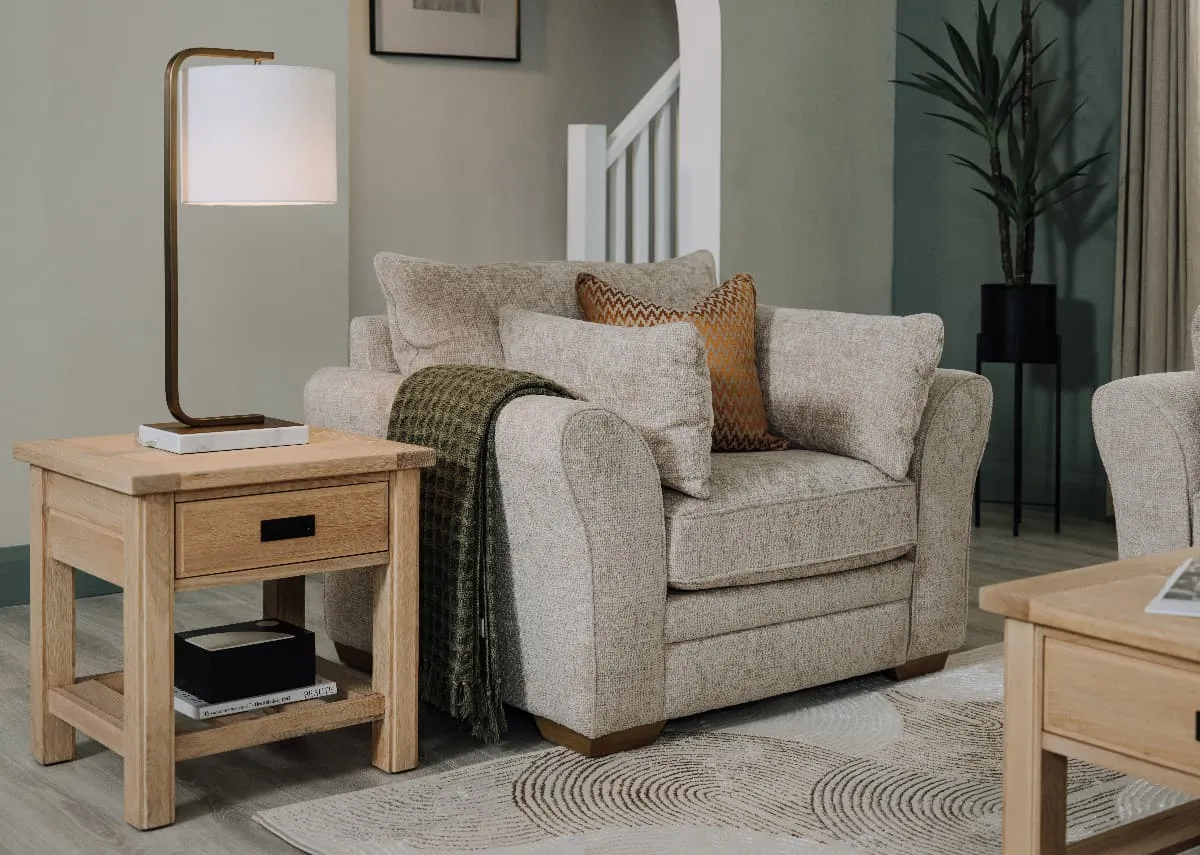 A lifebstyjle image of the Skyline armchair with Al bany side table and Phoenix table lamp.