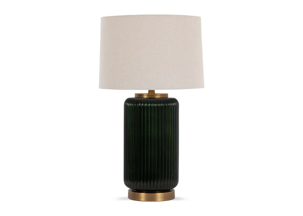 A ribbed gloss black table lamp with large white shade from EZ Livings Vail range. Front view of brass trim on base.
