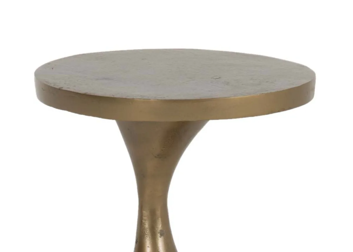 A gold side table from EZ Livings Bulan range.Closeup of textured table top.