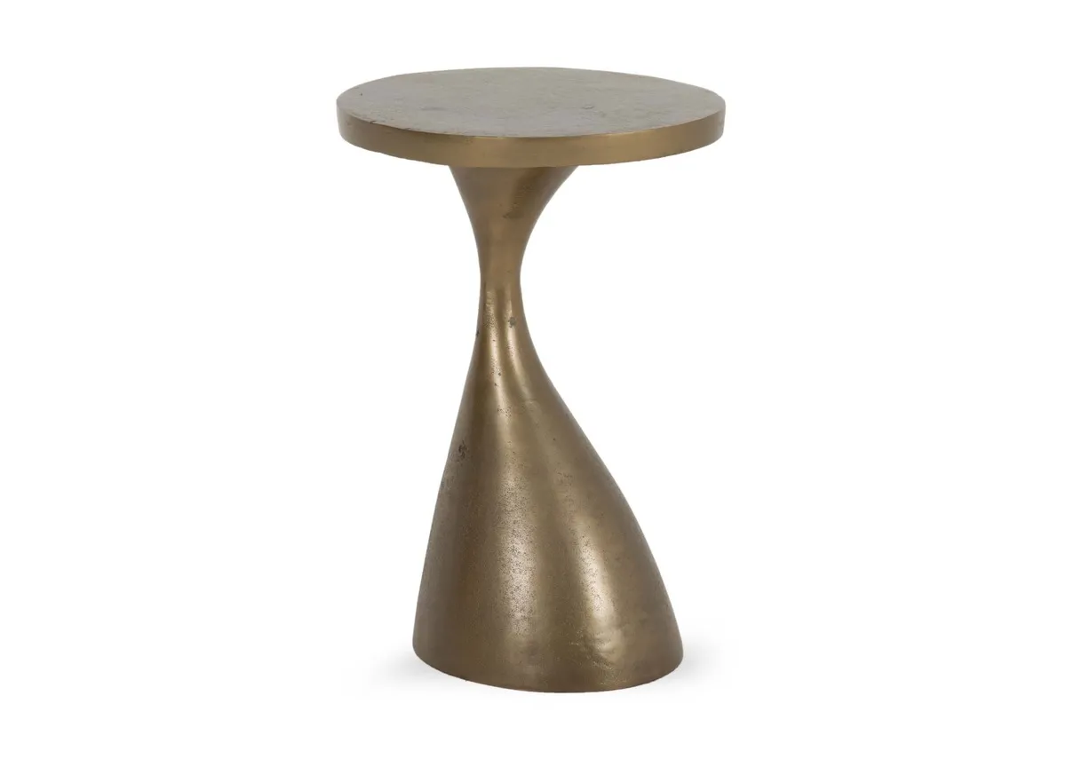 A gold side table from EZ Livings Bulan range. Angled view of sculptured style small table.