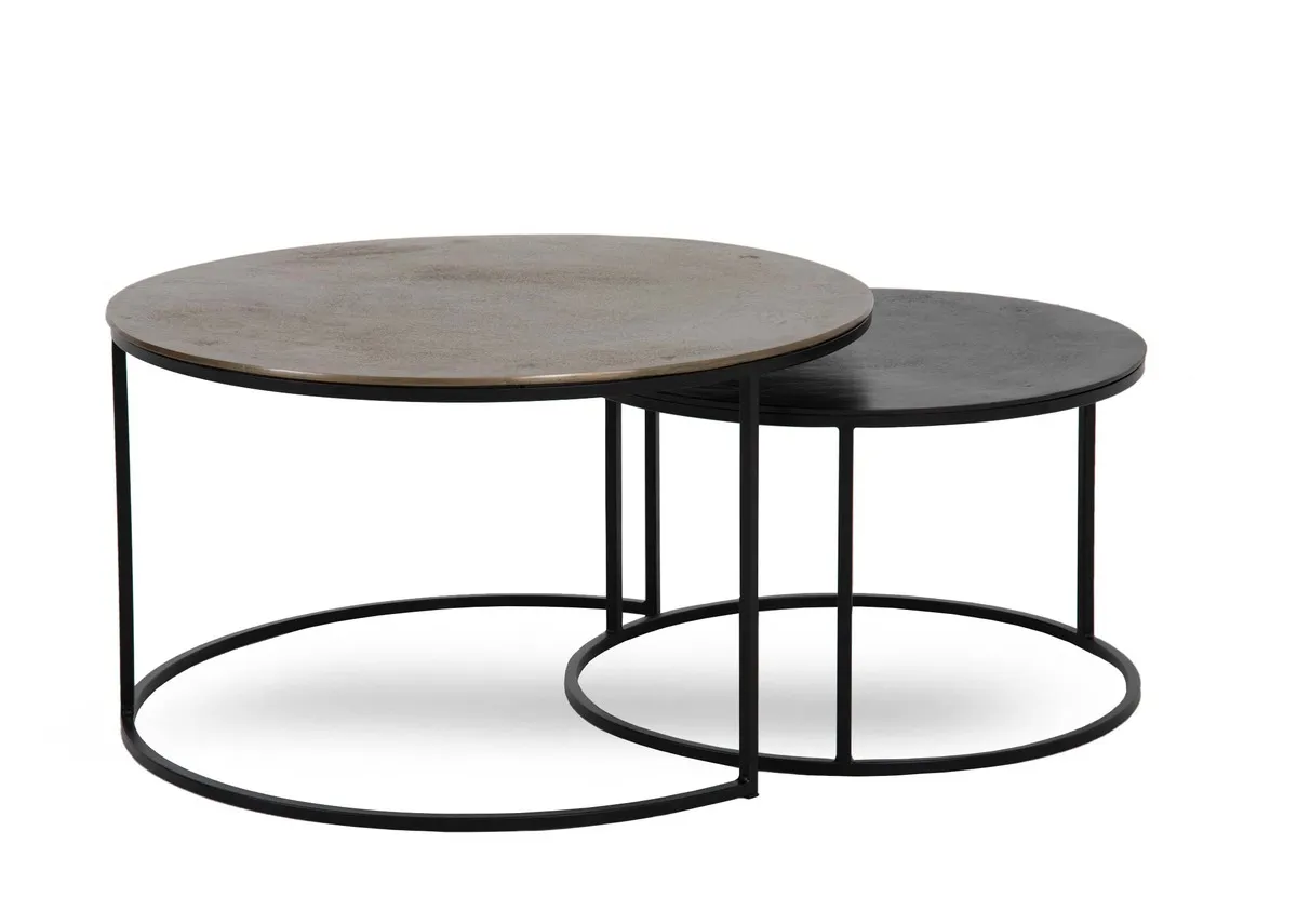 A nest of 2 black and brass coffee tables from EZ Living Furnitures Kersen rannge. Angled view of 2 tables that slide into one another.