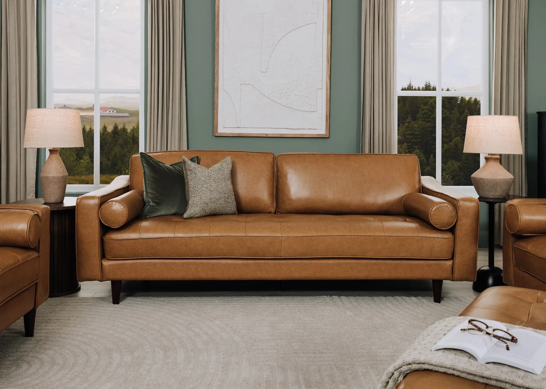 A lifetsyle image of the Genoa tan sofa with Green velvet and Barnacoghill cushions and Mai Lamps.
