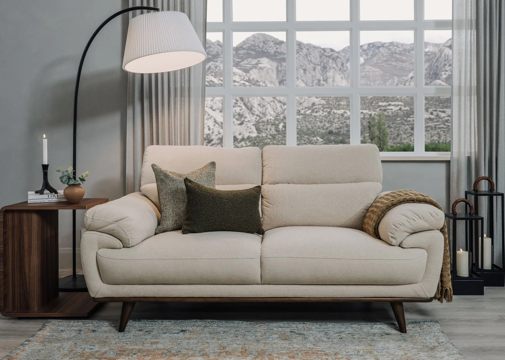 A lifestyle iamge of the Pippa sofa with Barna cushion and Boucle cushion