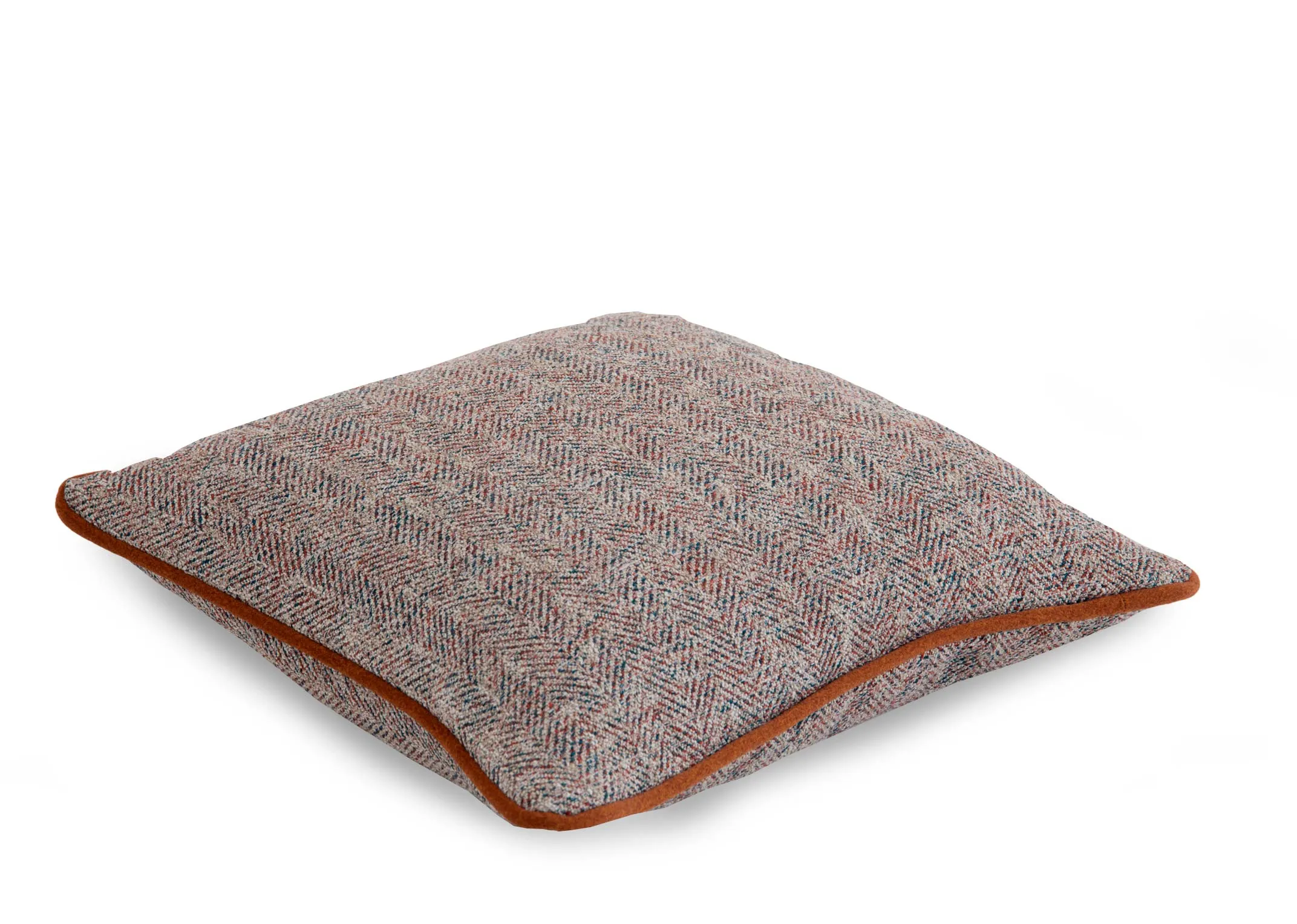 A copper velvet trim on an accent fabric cushion from EZ Livings Strandhill range. Angled view