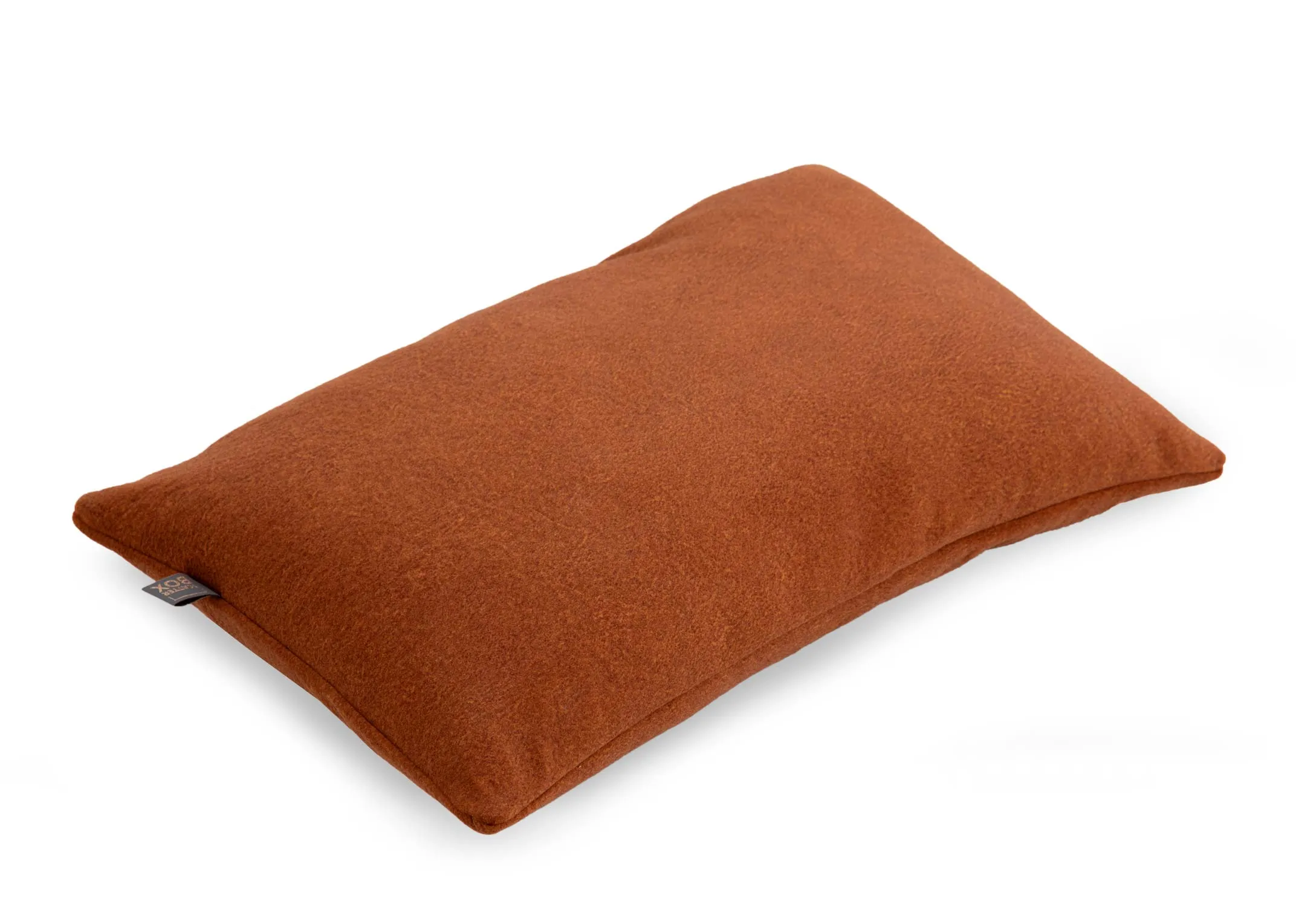 An orange fabric bolster cushion from EZ Livings Easkey range. Angled view of rectangular cushion