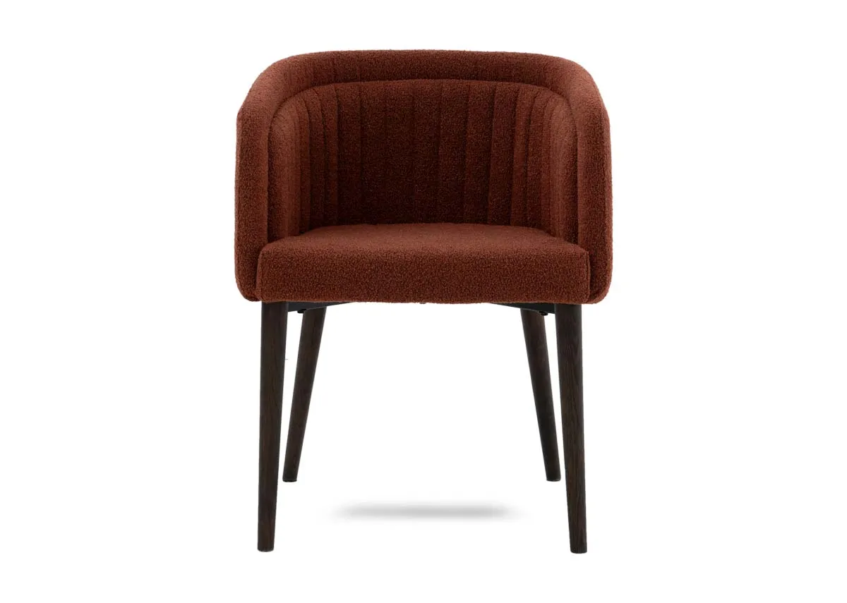 A curved orange dining chair from EZ Livings Bardot range.Front view