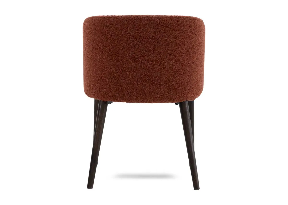 A curved orange dining chair from EZ Livings Bardot range. Back view