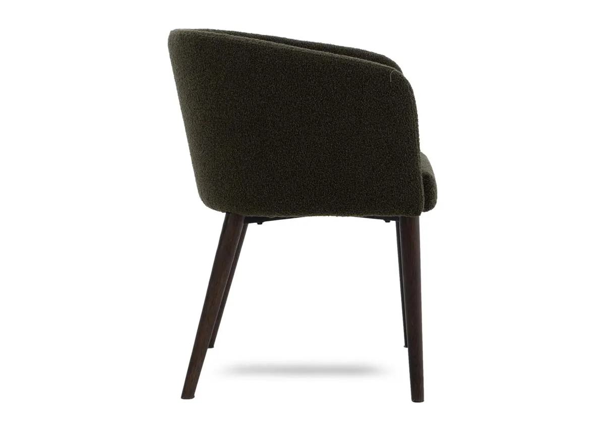 A green boucle dining chair from EZ Livings Bardot range. Side view