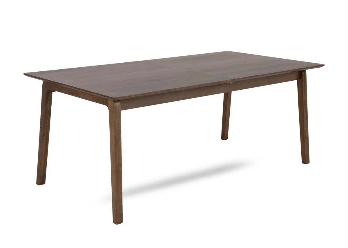 A smoked oak dining table from EZ Livings Bari range. Angled view of table fixed