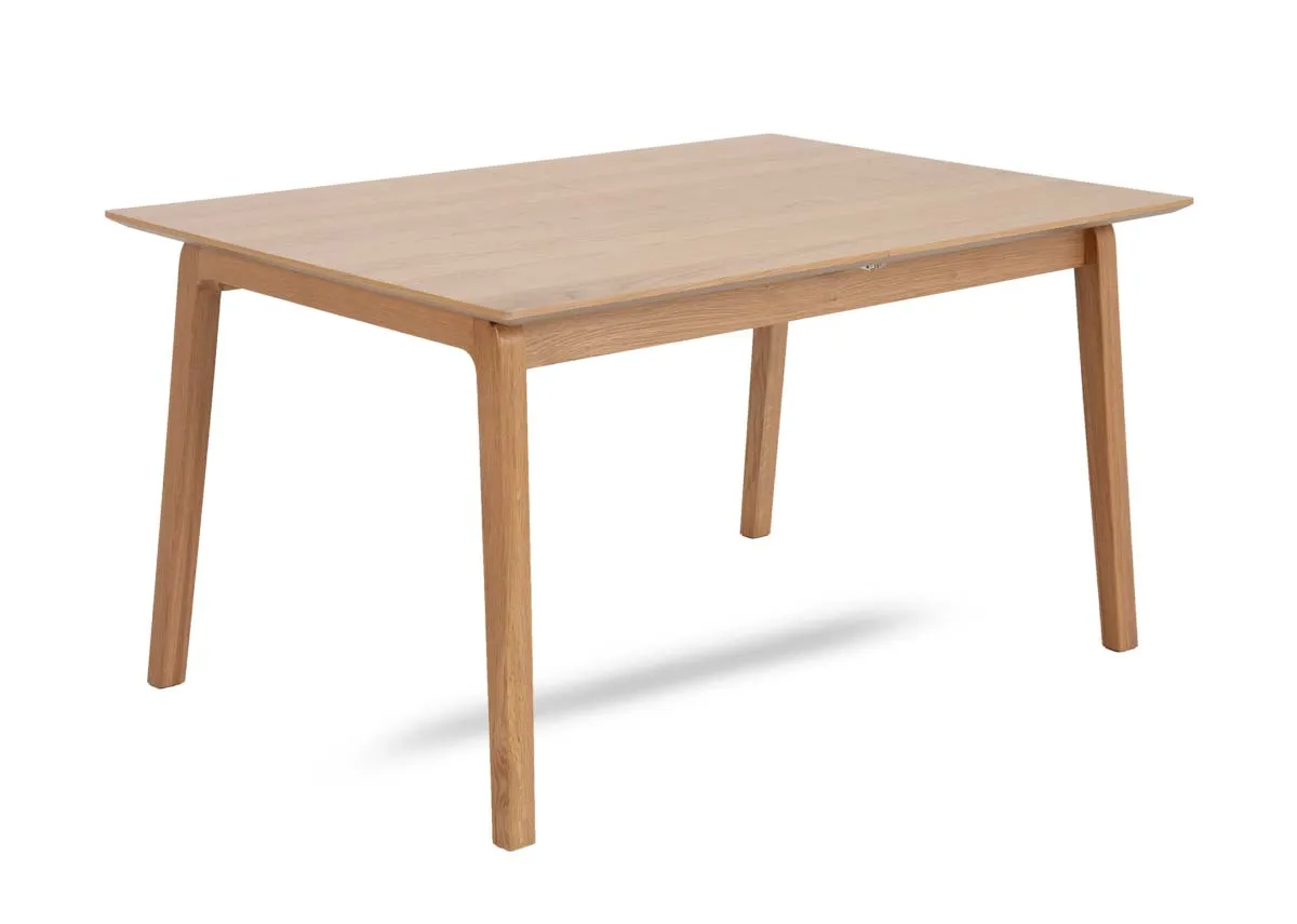 A natural oak dining table from EZ Livings Bari range. Angled view of table in fixed position.