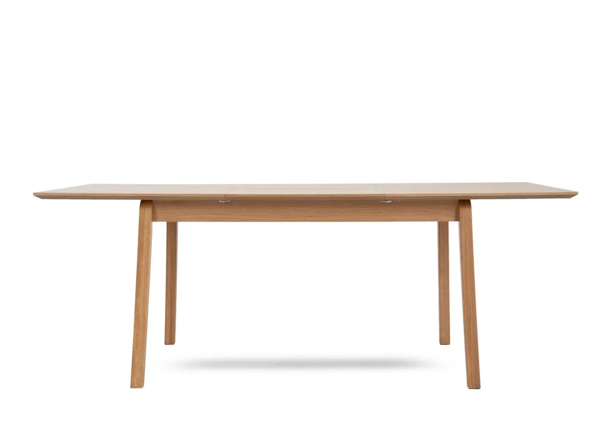 A natural oak dining table from EZ Livings Bari range.Front view of table extended