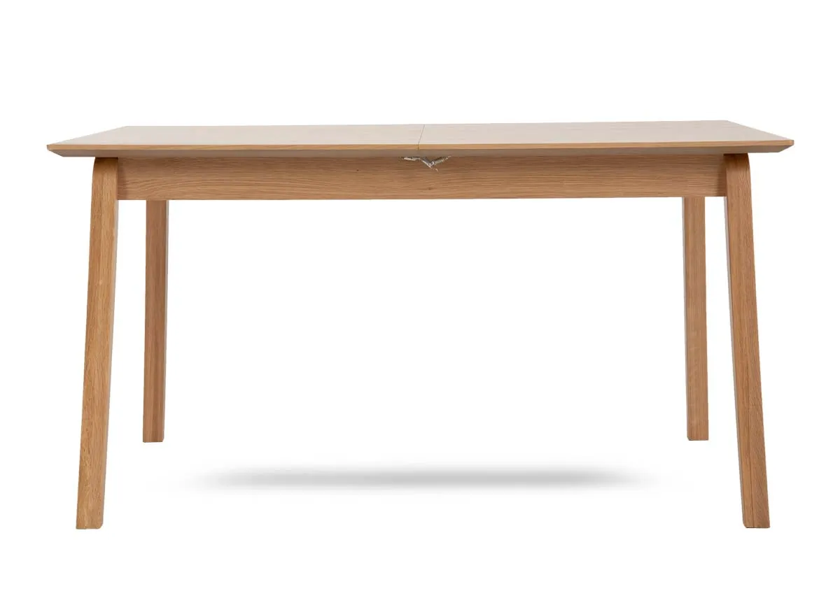 A natural oak dining table from EZ Livings Bari range.Front view of table fixed withour extension leaf