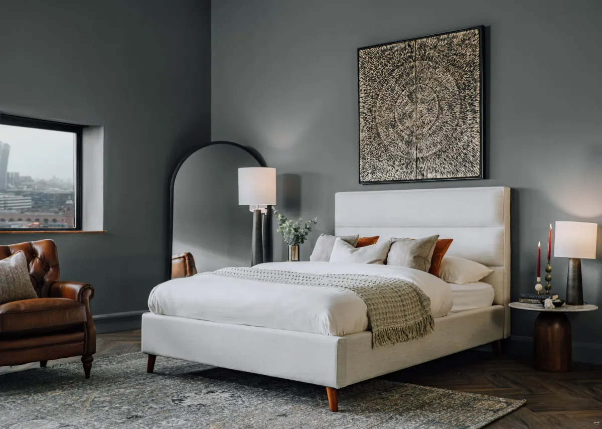 A lifestyle image of the Ebony bedframe with Dara canvas and Melody lamps with slade side tables