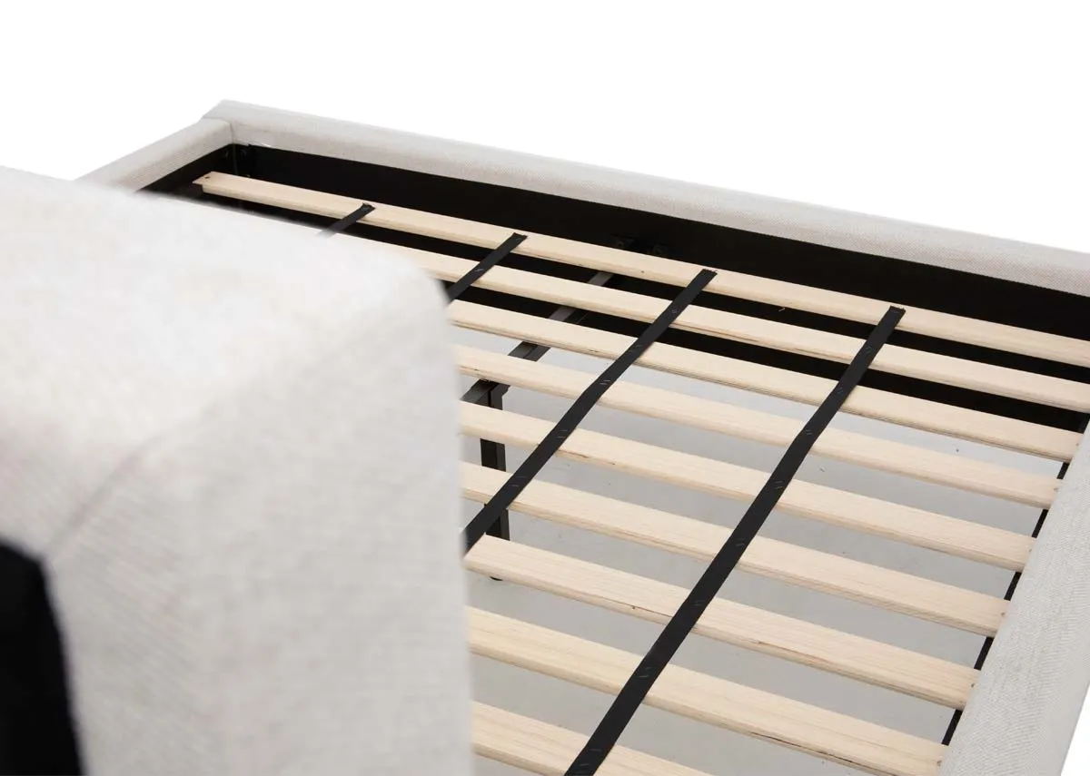 A beige fabric 6ft bedframe from EZ Livings Ebony range. Closeup of slat base