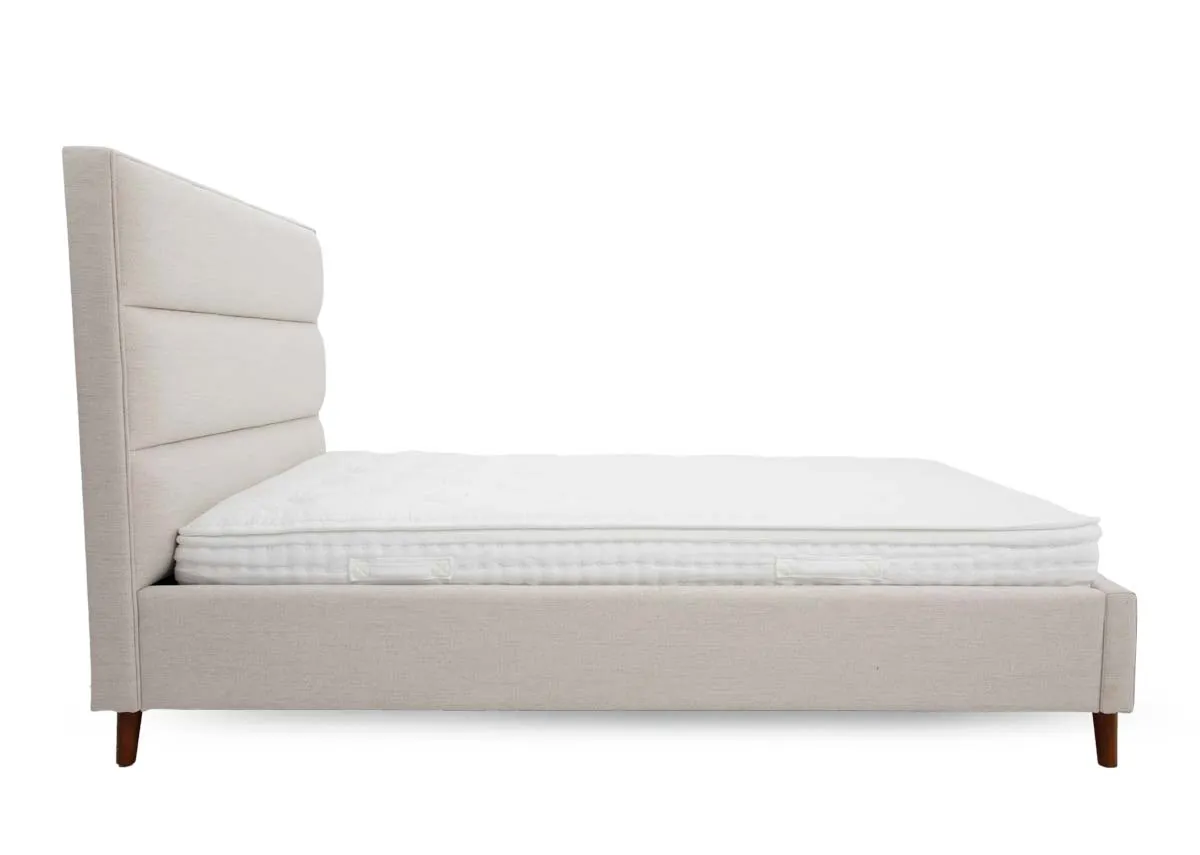 A beige fabric 6ft bedframe from EZ Livings Ebony range. Side view