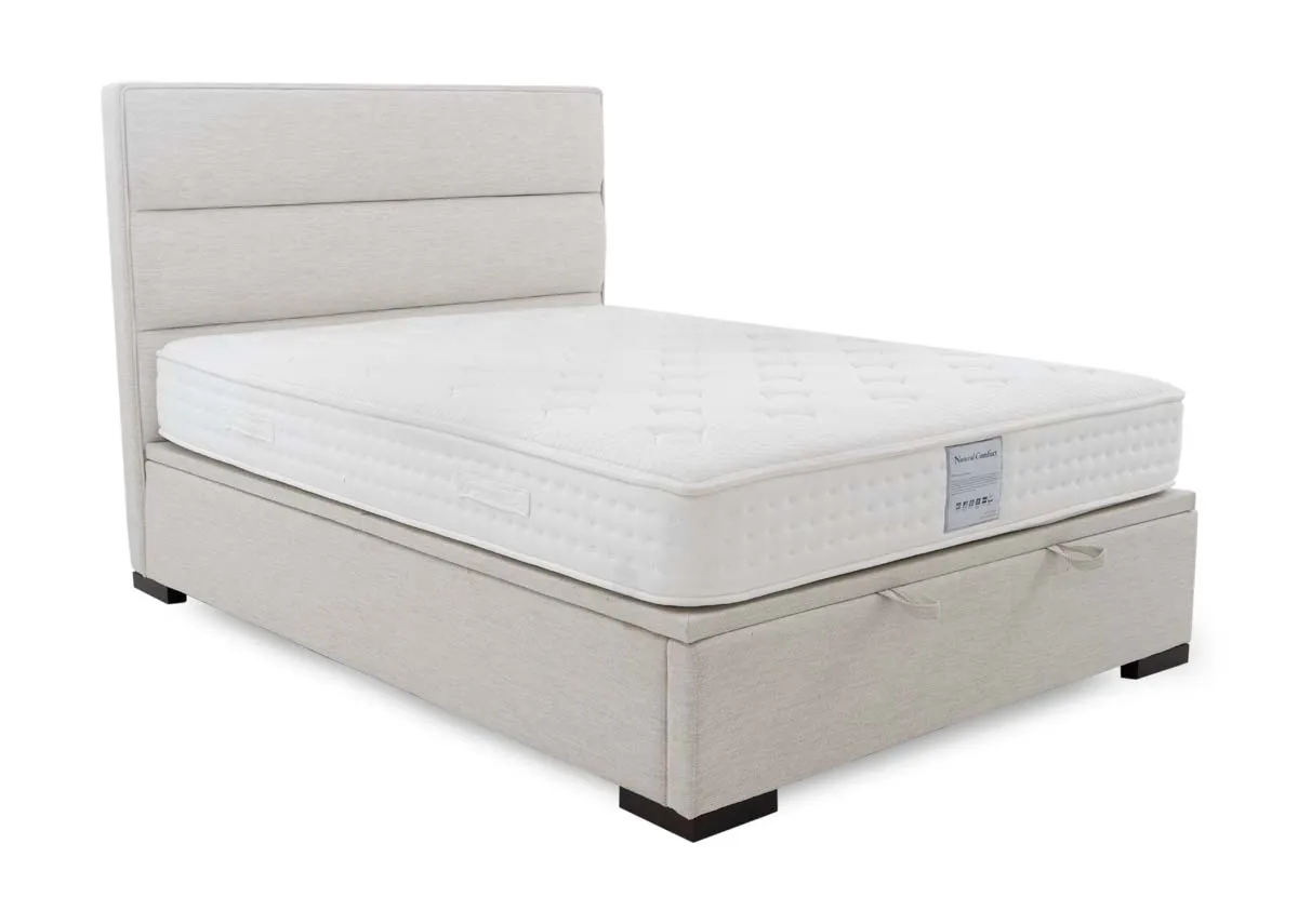 A beige fabric ottoman bed with mattress from EZ Livings Ebony range. Angled view.