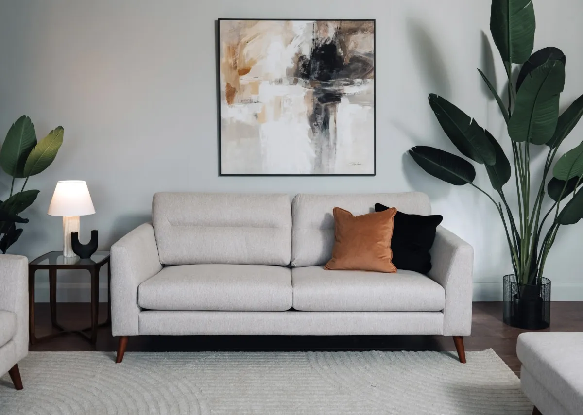 A lifestyle image of the Presley sofa with Cameo side table and Integrity canvas.