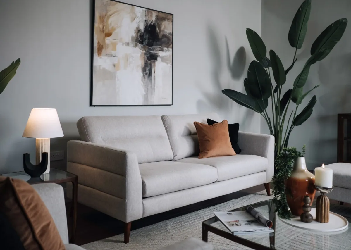 A lifestyle image of the Presley 3 seater with Integrity canvas and cameo side and coffee tables