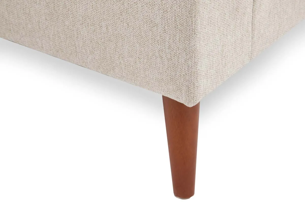 A beige corner chaise from EZ Livings Presley range. Closeup of oak feet