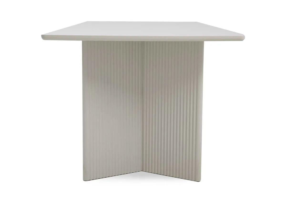 A large rectangular dining table in off white from EZ Livings Palma range. Side view of panel textured legs