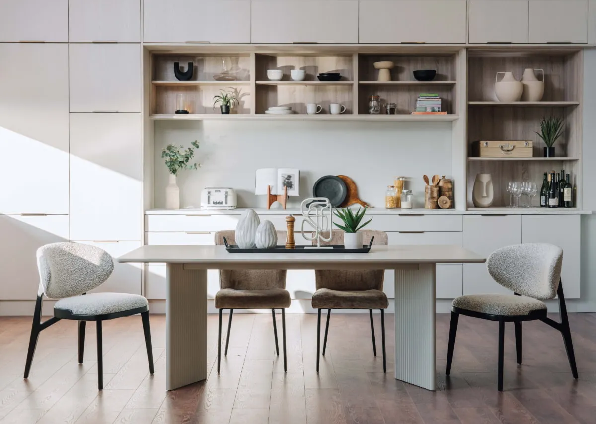 A lifestyle image of the Palma dining table with Joey chairs and Maple in a kitchen setting.