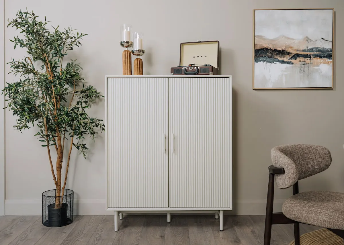 A lifestyle image of the Palma Cabinet with doors closed showing fluted detail