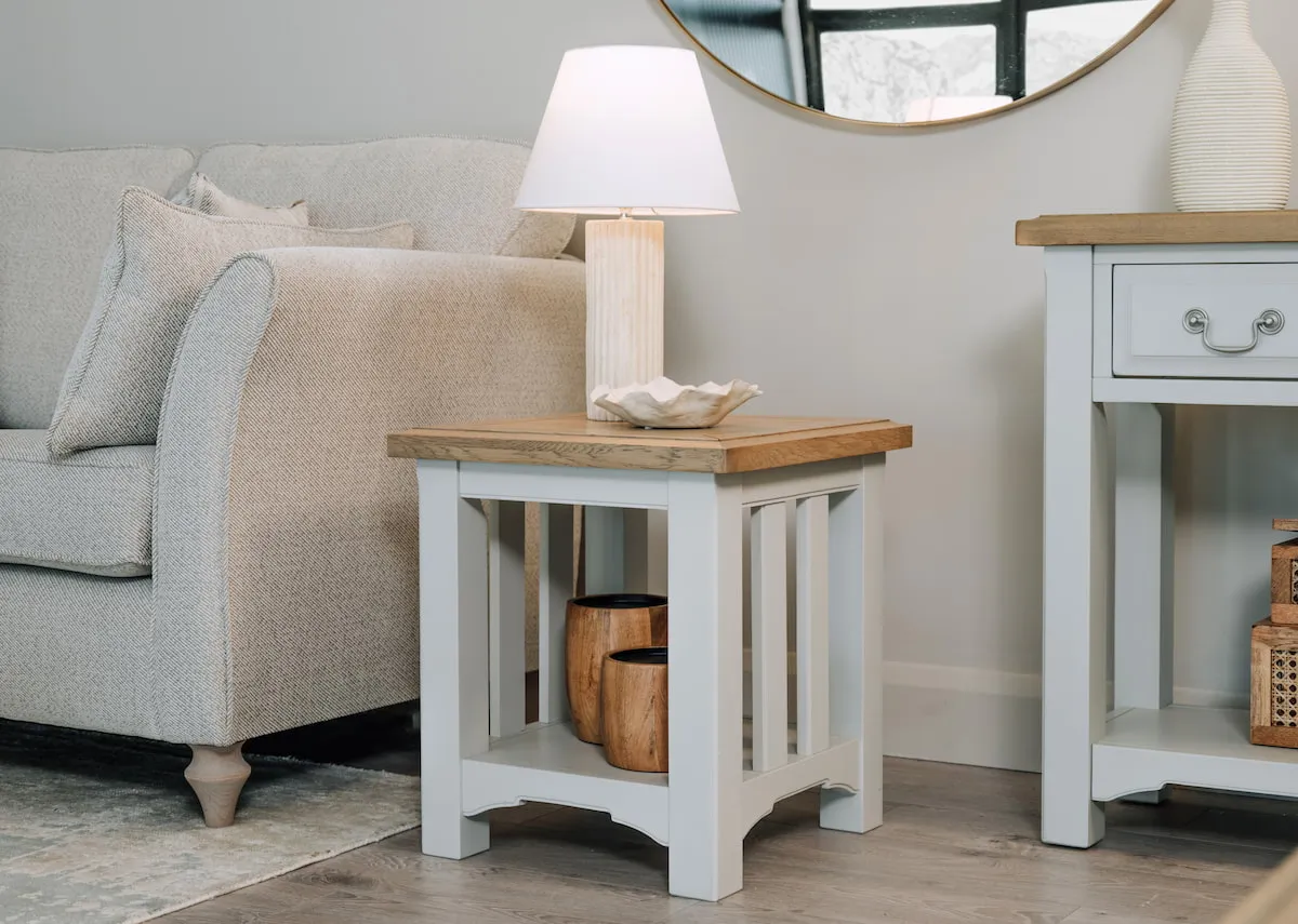 A lifestyle image of the Georgia lamp table with Edith table lamp with the Cooolmore sofa.