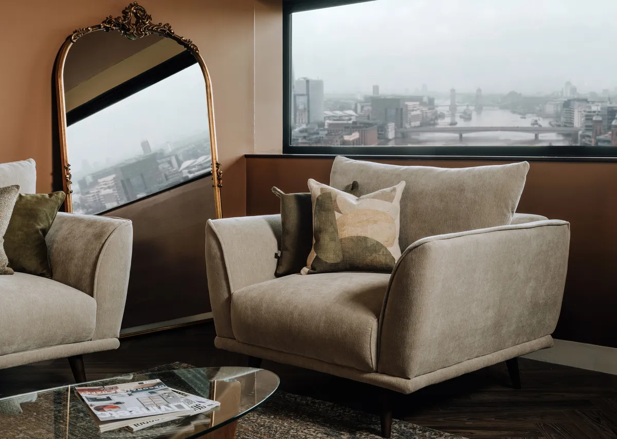 A lifestyle image of the Boutique silver cuddler with Geo stack cushion.