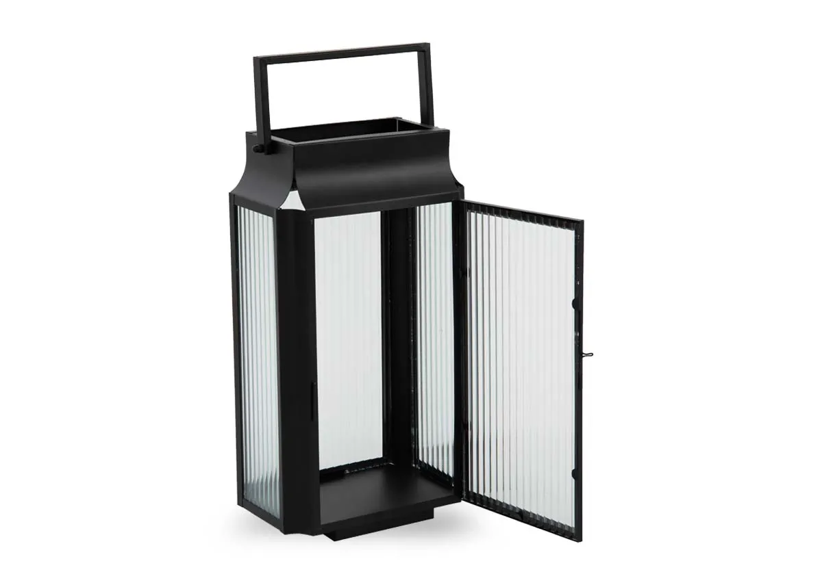 A small black framed lantern with frosted glass from EZ Livings Ellis range. Angled view of door of lantern open for candle