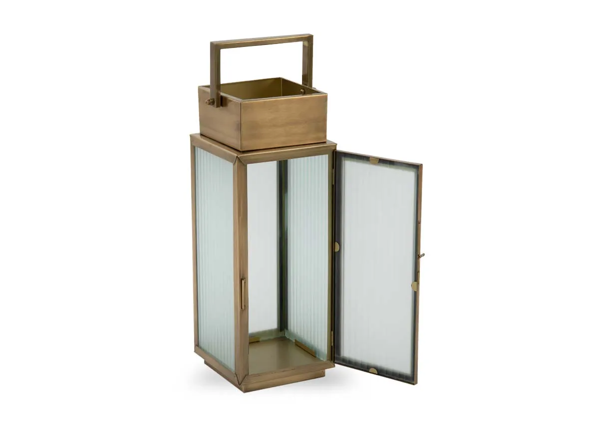 A small gold metal framed lantern from EZ Livings Dalia range. Angled view of door open for candle