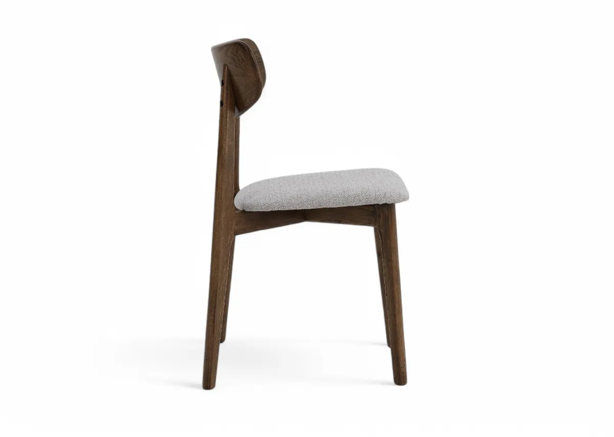 A smoked oak frame dining chair with cream fabric seat from EZ Livings Bari range.Side view