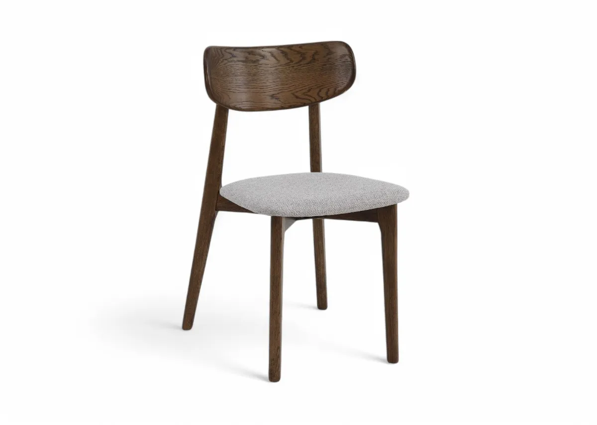 A smoked oak frame dining chair with cream fabric seat from  EZ Livings Bari range. Angled view