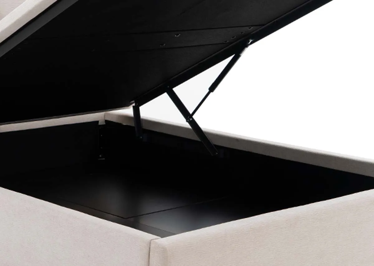 A lifestyle image of the Sadie Ottoman with slade tables with storage open showing space
