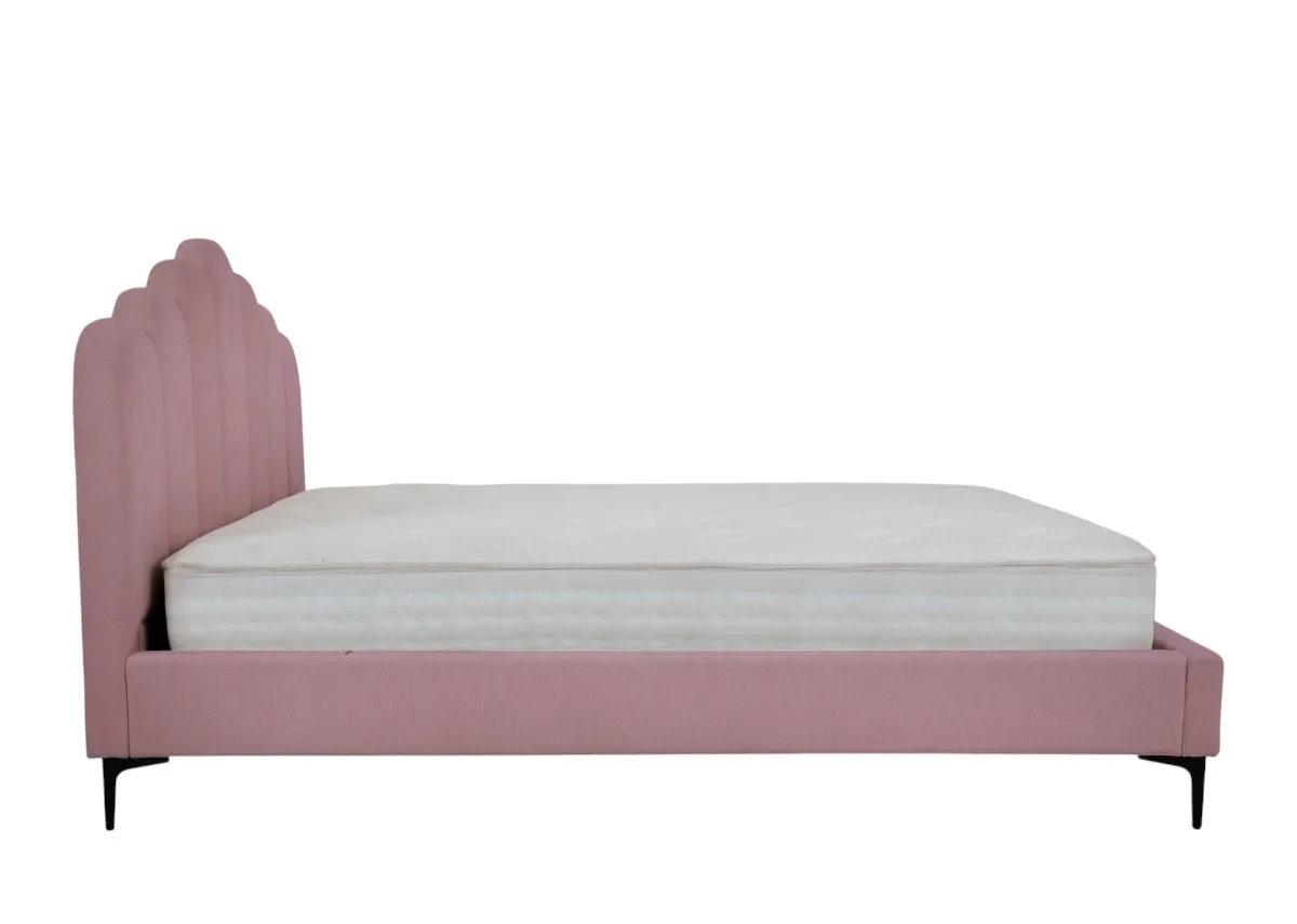 A pink bedframe with scalloped headboard from EZ Livings Fay range.Side view